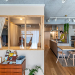 文京区のマンションのリノベーション後のリビングと個室とキッチン
